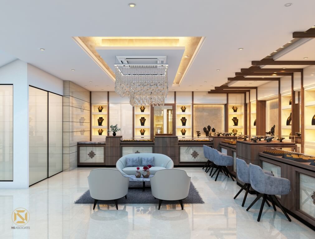 Jewellery showroom interior with crystal chandelier, gold-lit display cases and curved lounge seating, Hyderabad